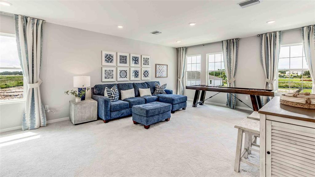 17527 Maple Grv Road Land O Lakes, FL 34638 - Photo 11 of 17 a living room with furniture and a large window