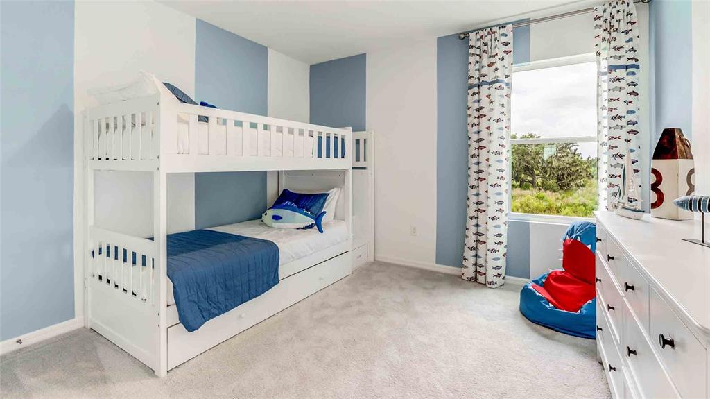 17527 Maple Grv Road Land O Lakes, FL 34638 - Photo 14 of 17 a bedroom with a bed and a window