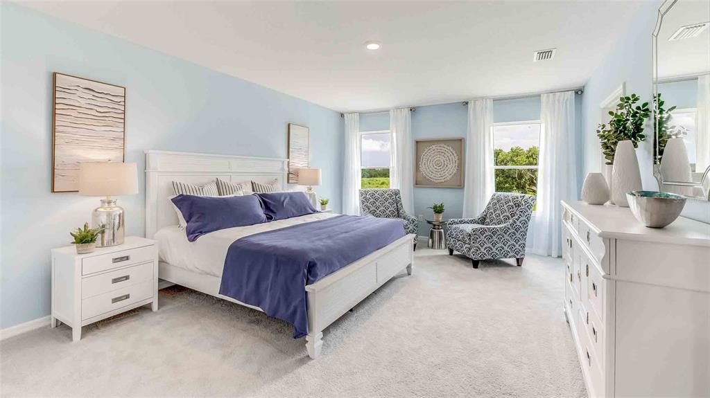 17527 Maple Grv Road Land O Lakes, FL 34638 - Photo 16 of 17 a spacious bedroom with a bed and a couch