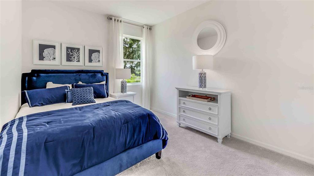 17527 Maple Grv Road Land O Lakes, FL 34638 - Photo 8 of 17 a bedroom with a bed and a window