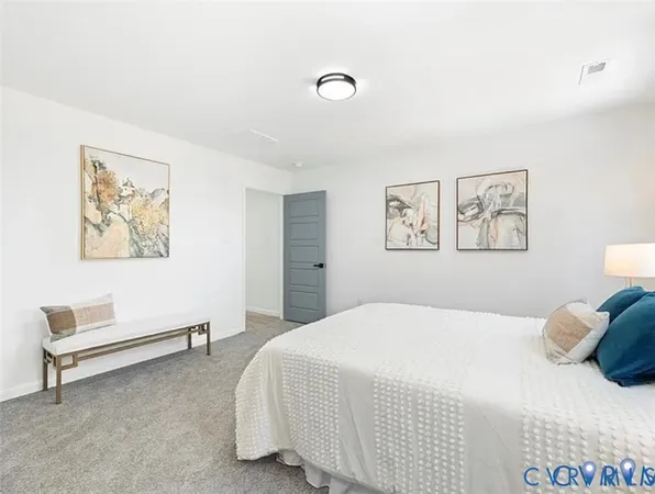 a bedroom with a bed and a desk
