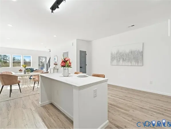 a view of kitchen island with furniture and wooden floor