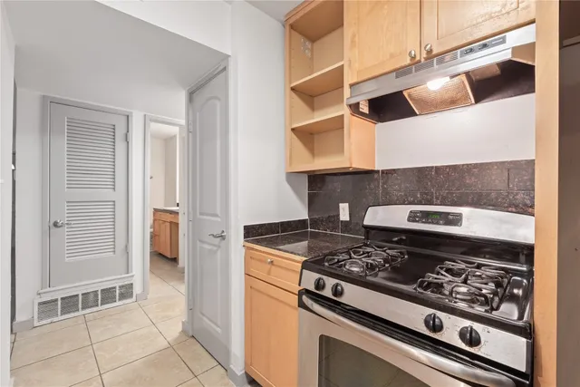 a kitchen with a stove and a microwave