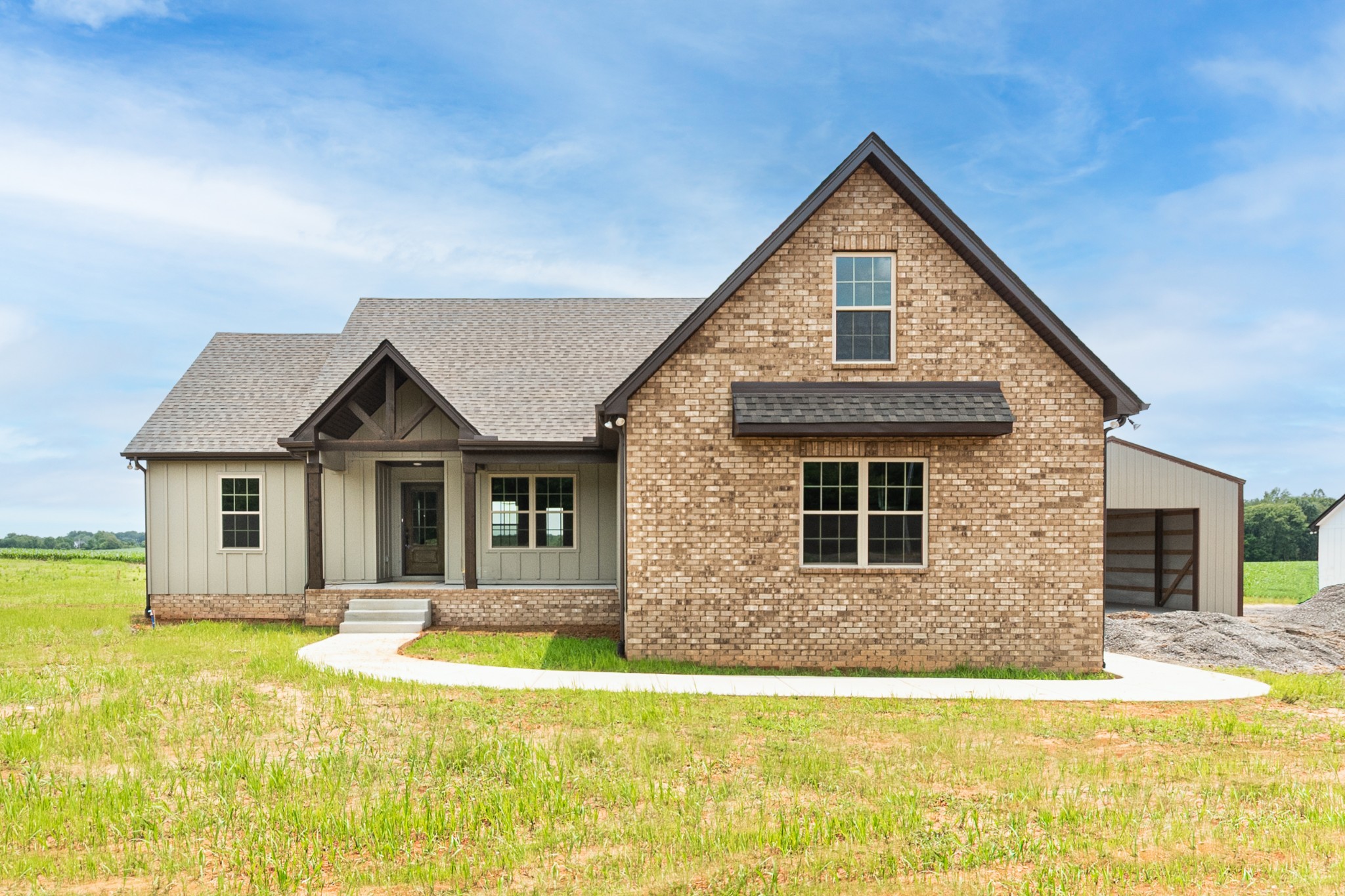 928 Butler Bridge Road Portland, TN 37148 - Photo 1 of 26 a front view of a house with a yard