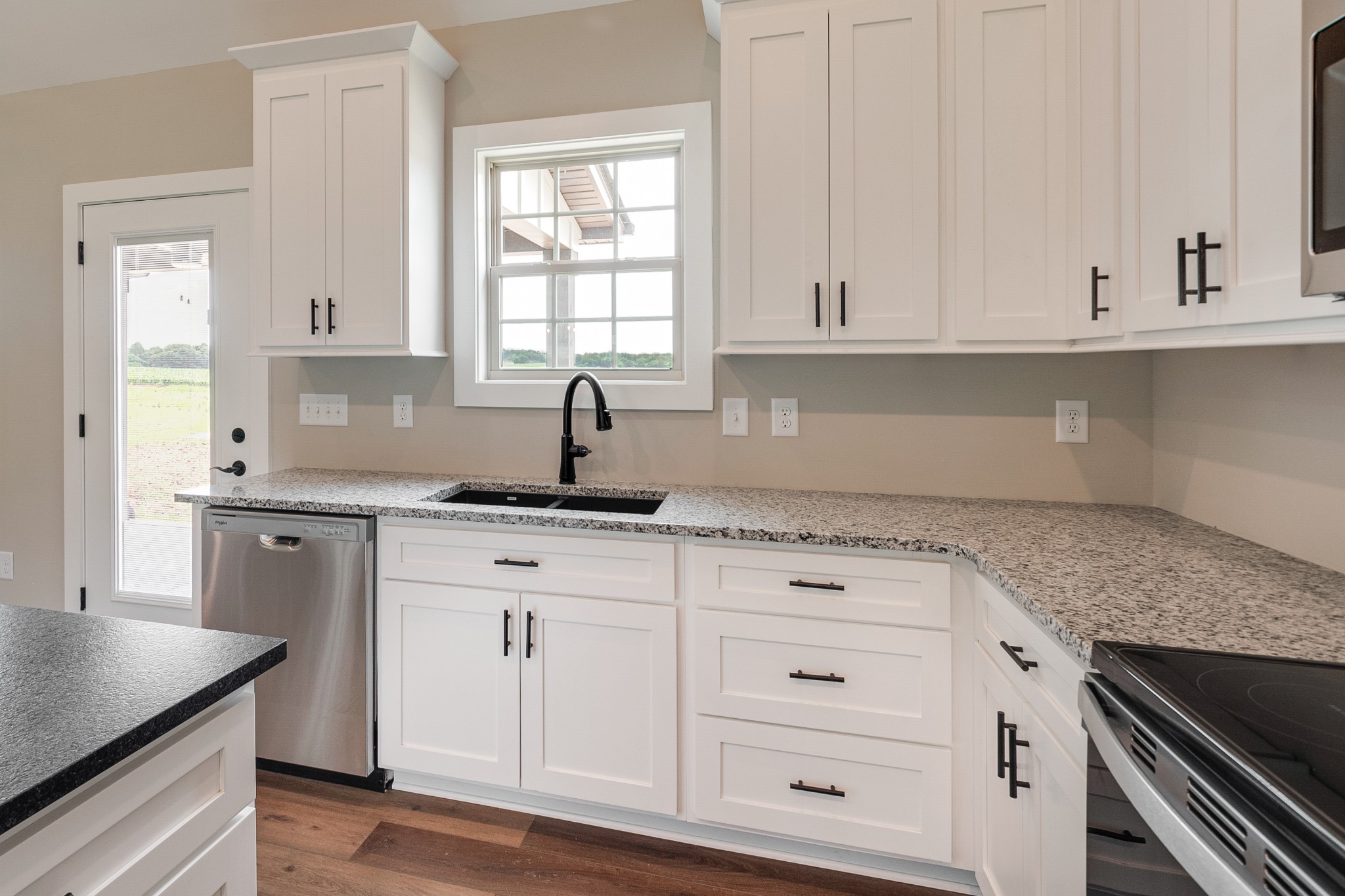 928 Butler Bridge Road Portland, TN 37148 - Photo 11 of 26 a kitchen with granite countertop white cabinets and a sink
