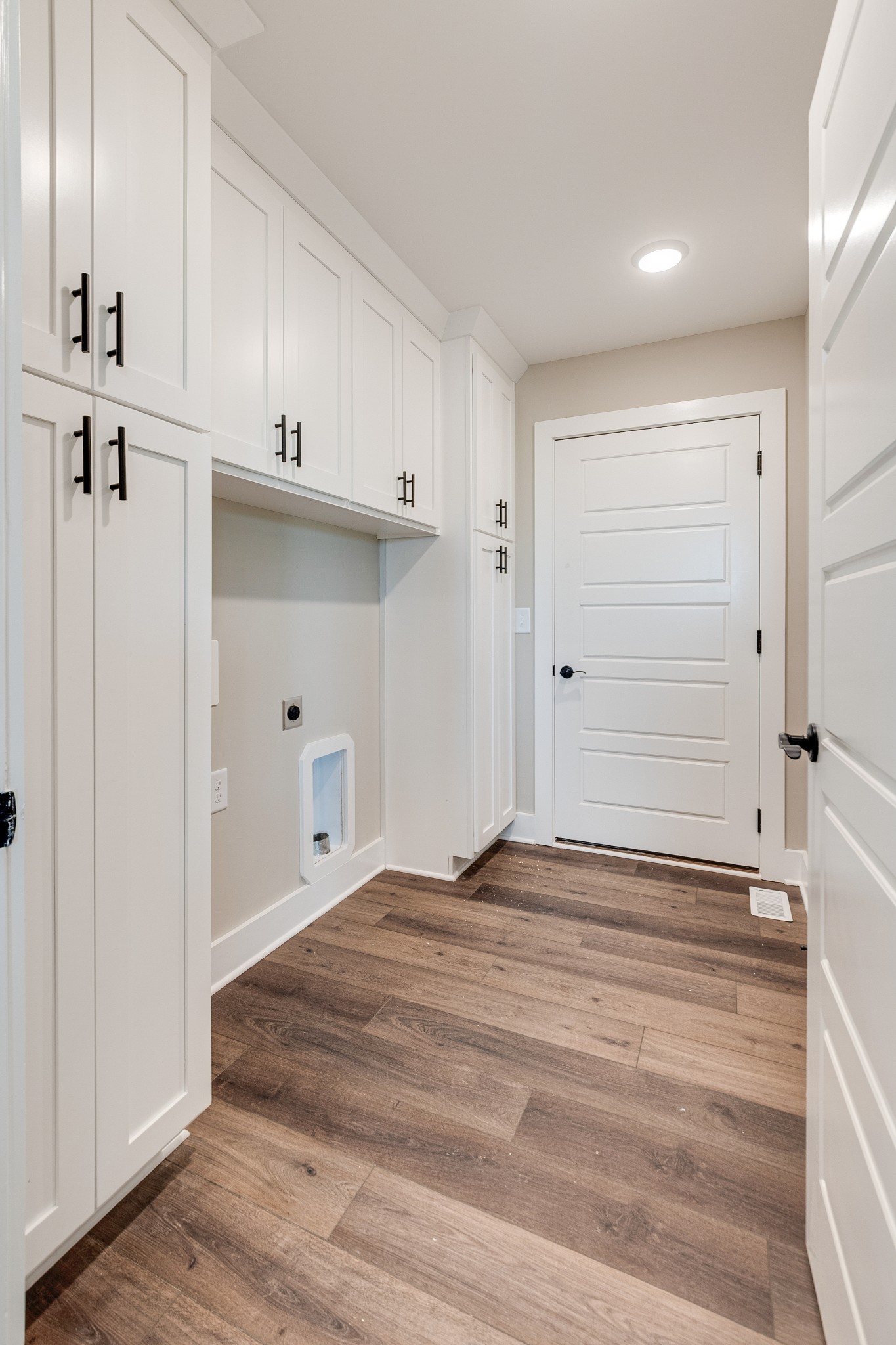 928 Butler Bridge Road Portland, TN 37148 - Photo 15 of 26 a view of a hallway with closet and wooden floor