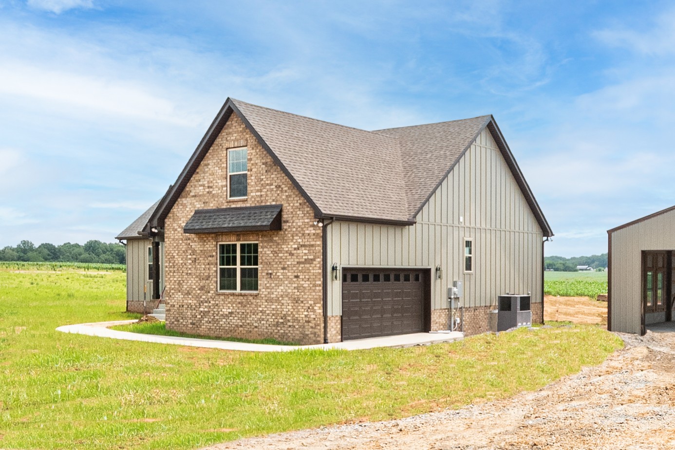 928 Butler Bridge Road Portland, TN 37148 - Photo 2 of 26 a view of a house with a yard and potted plants