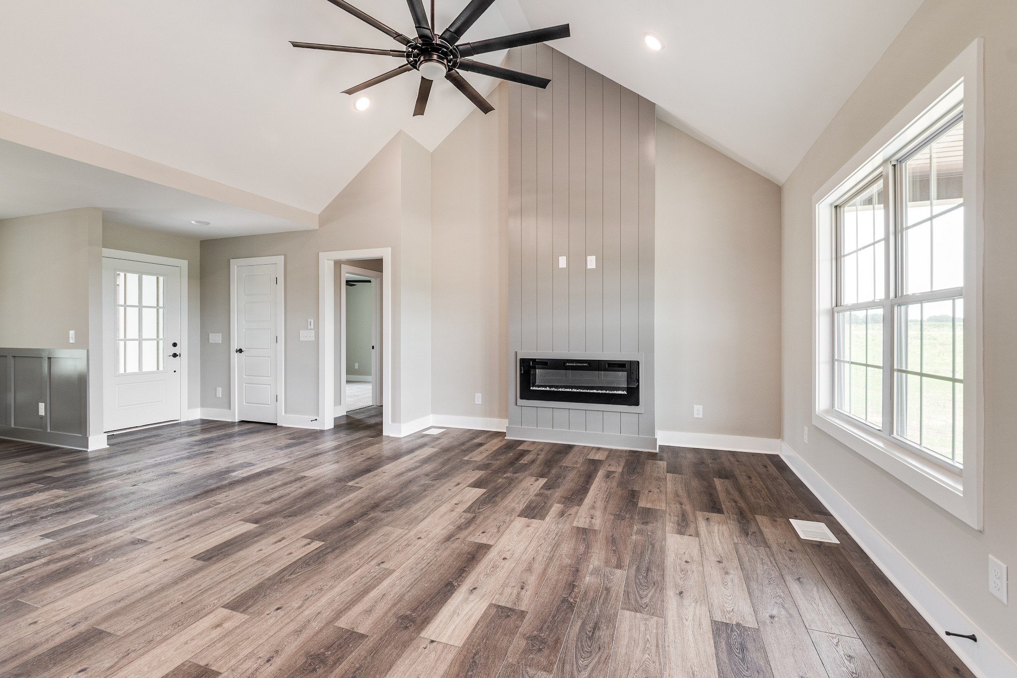 928 Butler Bridge Road Portland, TN 37148 - Photo 6 of 26 a view of empty room with wooden floor and window