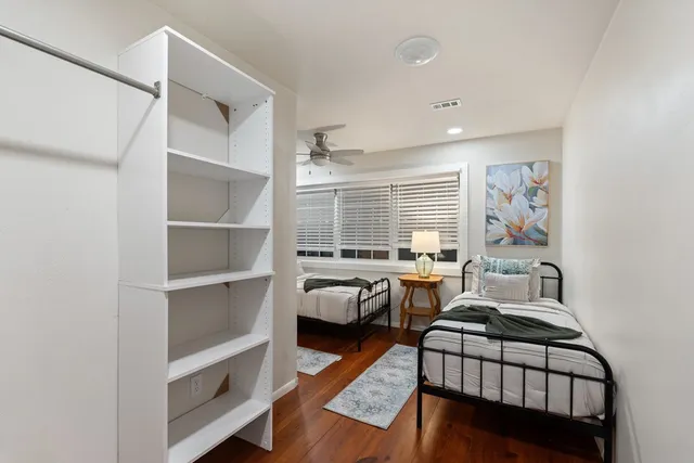 a bedroom with furniture and a window