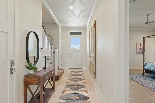 a very nice looking room with a large window and wooden floor