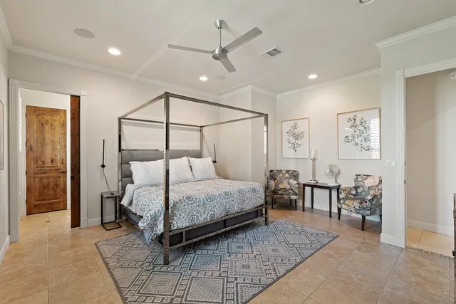 a bedroom with a bed and ceiling fan