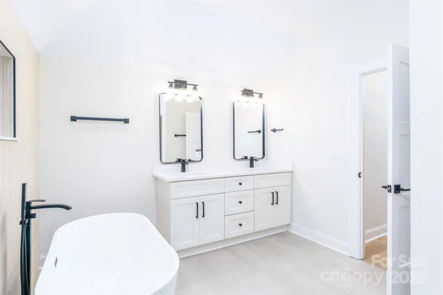 a utility room with sink dryer and washer