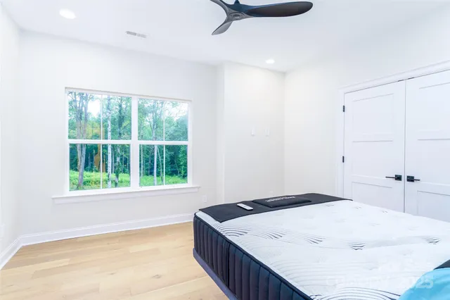 a bathroom with a sink a mirror and shower