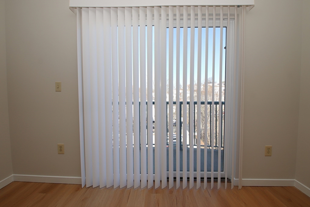 175 Cottage Street, Unit 501 Chelsea, MA 02150 - Photo 11 of 42 a view of a porch with a wooden floor