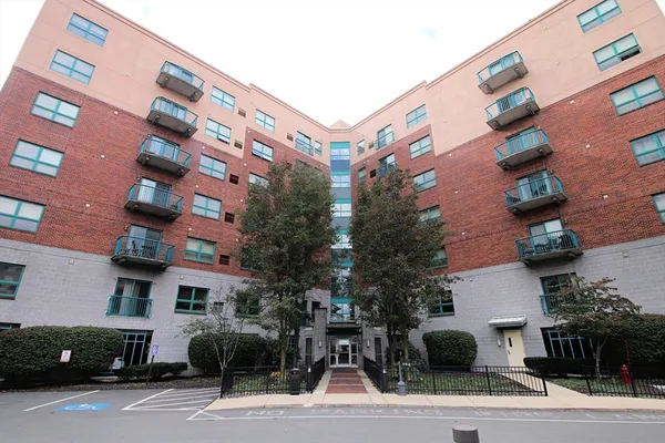 a front view of a building with street view