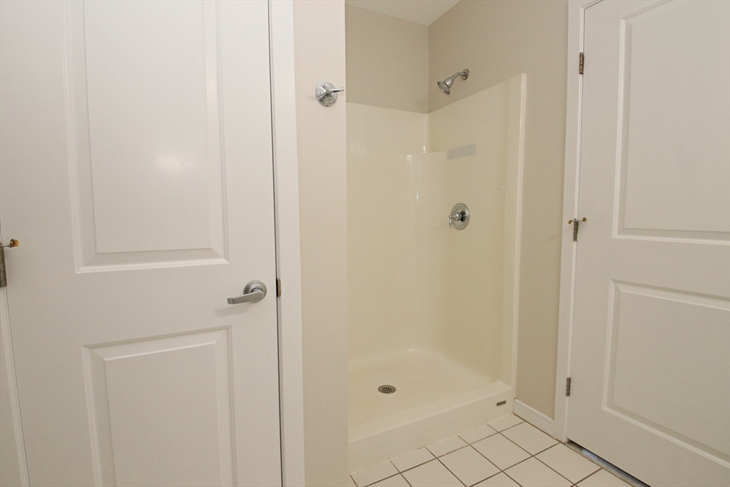 175 Cottage Street, Unit 501 Chelsea, MA 02150 - Photo 23 of 42 a bathroom with a shower