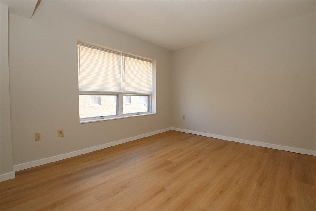 175 Cottage Street, Unit 501 Chelsea, MA 02150 - Photo 25 of 42 an empty room with a window