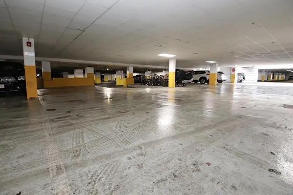 a view of parking space with parked cars