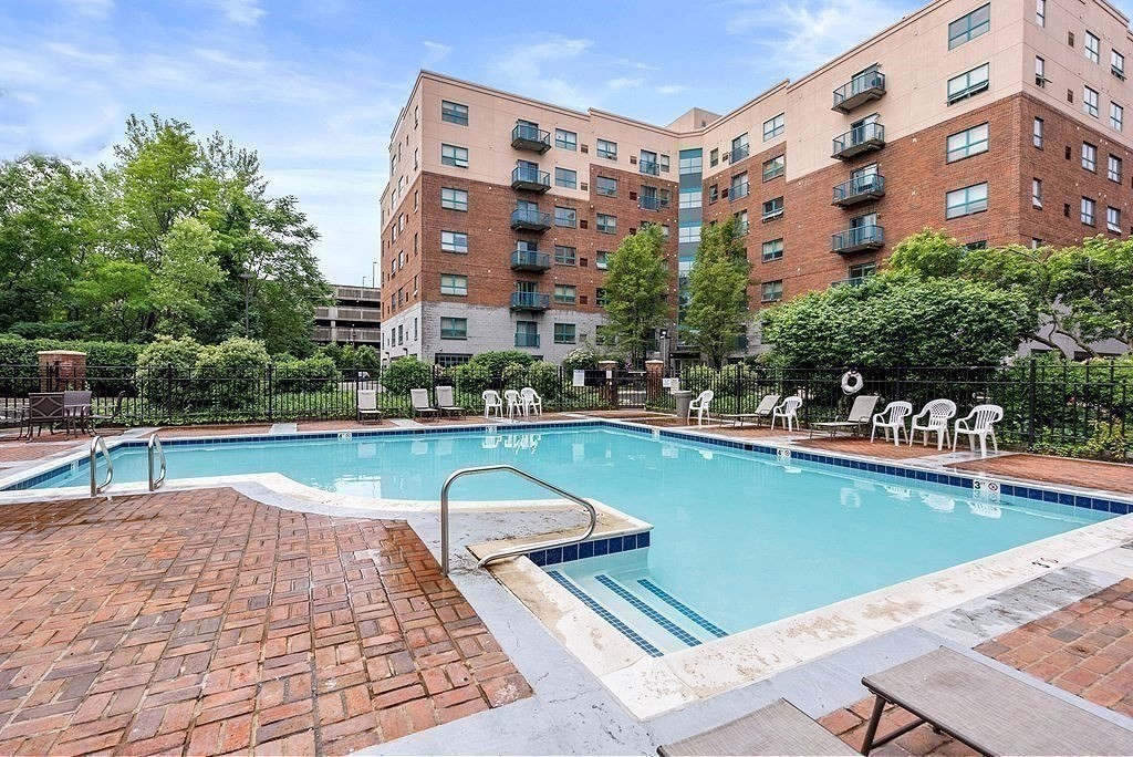 175 Cottage Street, Unit 501 Chelsea, MA 02150 - Photo 42 of 42 a view of a swimming pool with a bench