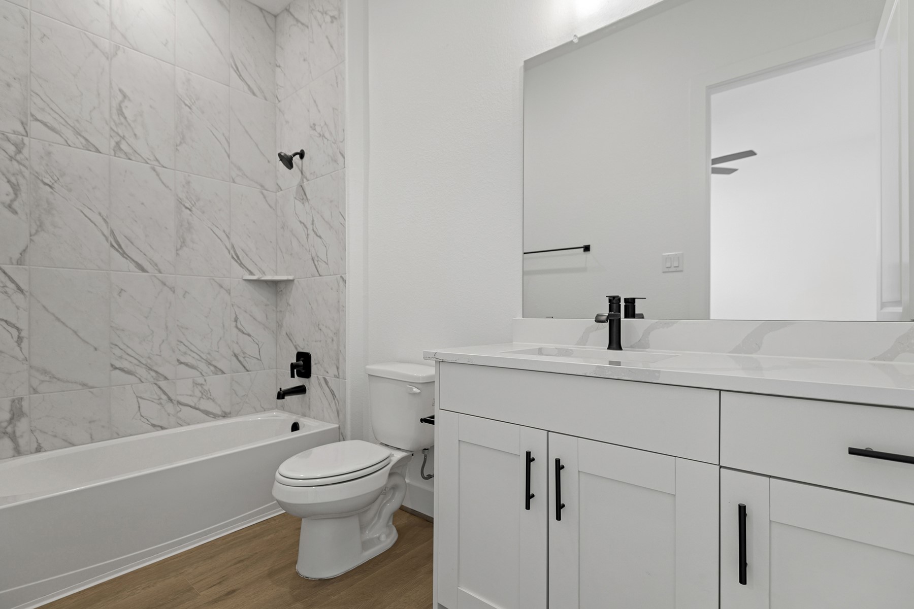 1911 Drover Lane Rosenberg, TX 77471 - Photo 21 of 22 a bathroom with a toilet a sink and a bathtub