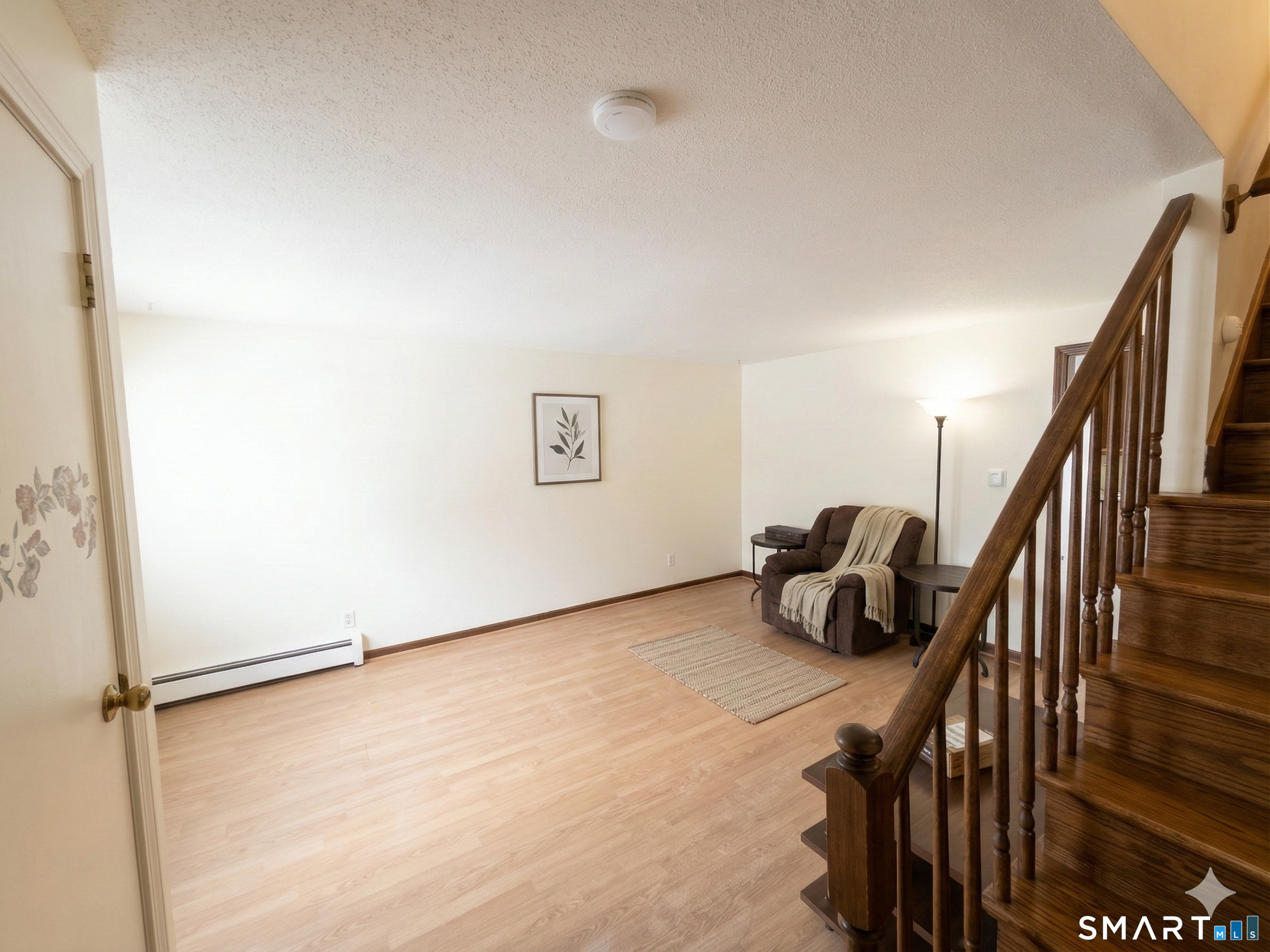 40 Grove Street, Unit B Manchester, CT 06042 - Photo 5 of 13 a room with stairs and a wooden floor