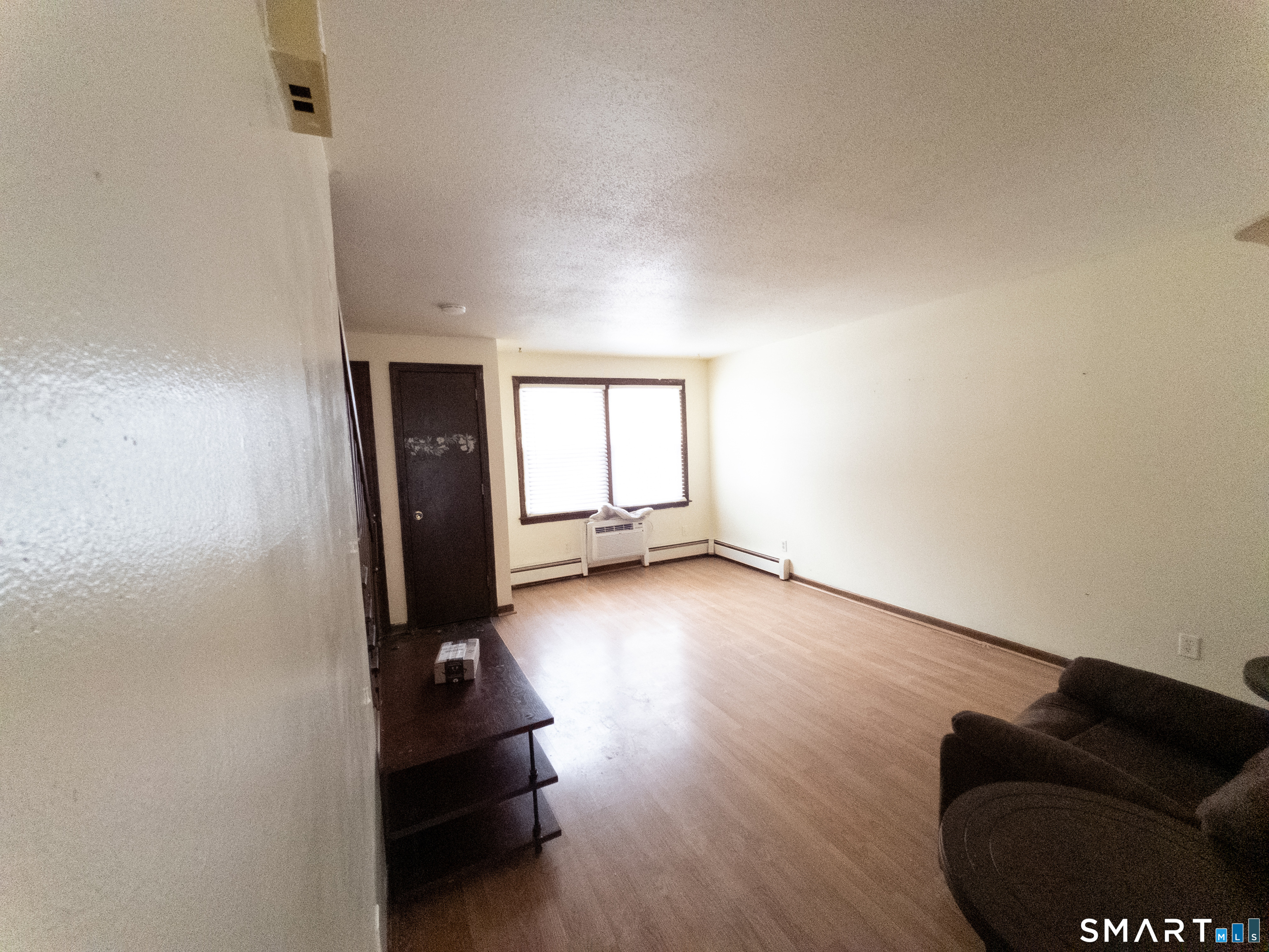 40 Grove Street, Unit B Manchester, CT 06042 - Photo 7 of 13 wooden floor in an empty room with a window