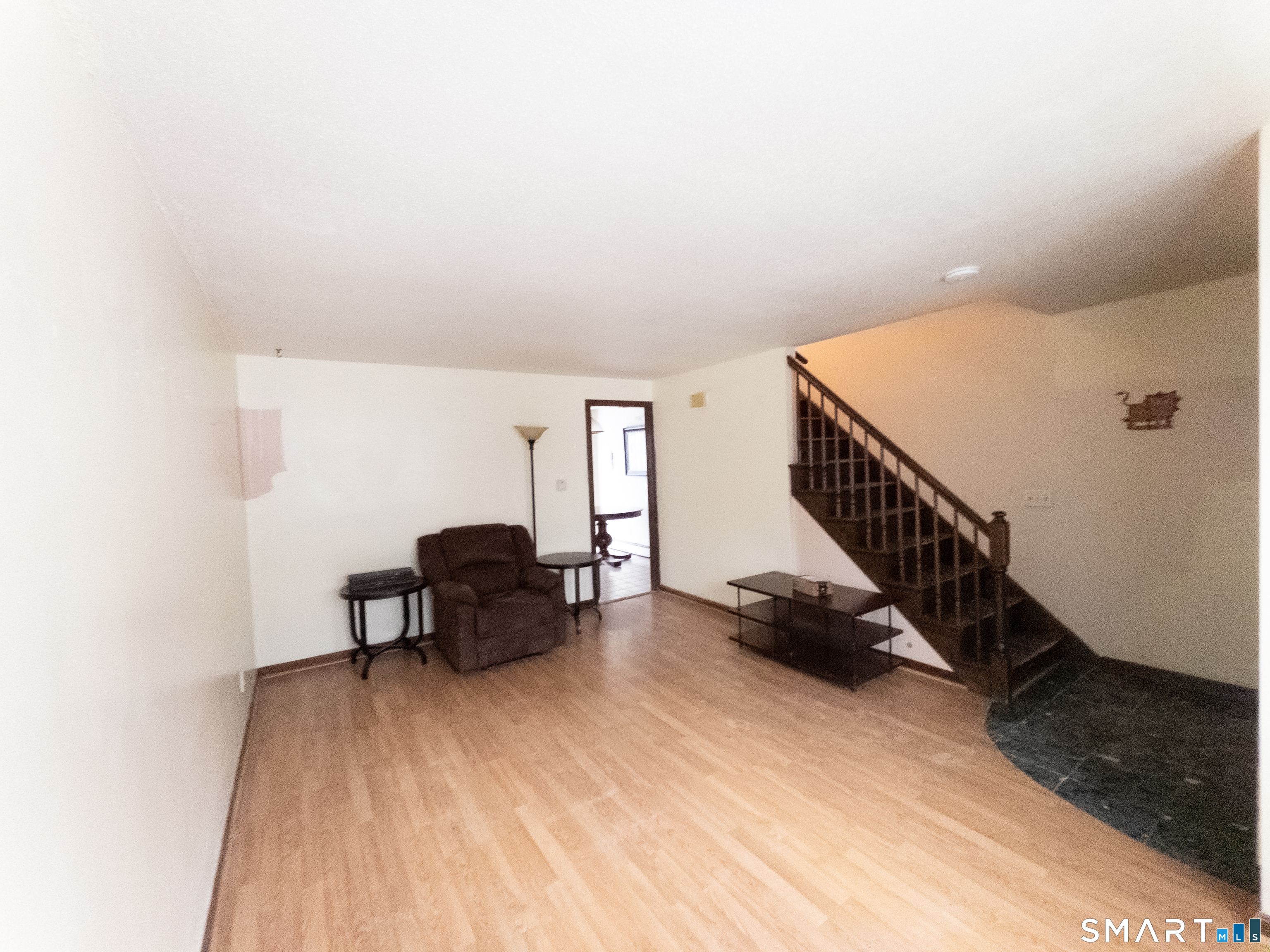 40 Grove Street, Unit B Manchester, CT 06042 - Photo 8 of 13 a view of a livingroom with furniture and staircase