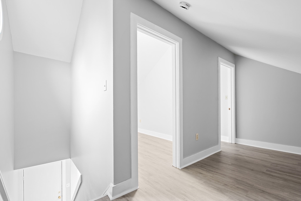 572 William Street Fall River, MA 02721 - Photo 17 of 31 a view of a hallway with wooden floor