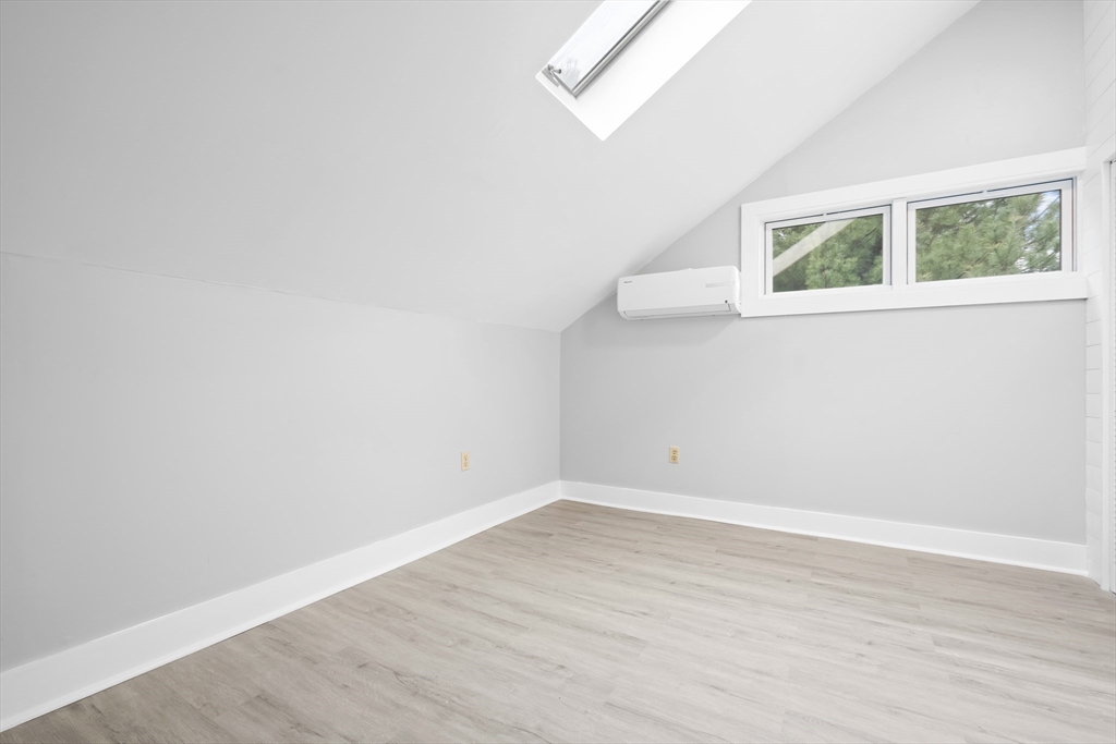 572 William Street Fall River, MA 02721 - Photo 18 of 31 an empty room with wooden floor and windows