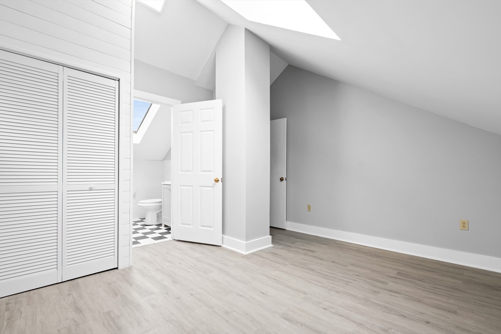 572 William Street Fall River, MA 02721 - Photo 20 of 31 an empty room with wooden floor and windows