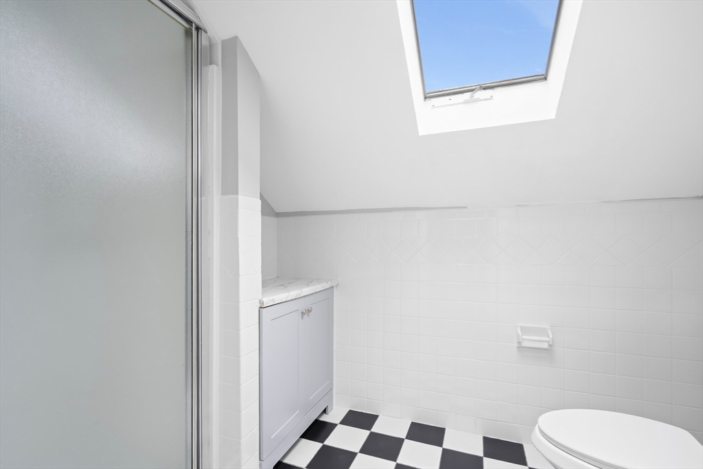 572 William Street Fall River, MA 02721 - Photo 23 of 31 a bathroom with a toilet and a shower curtain