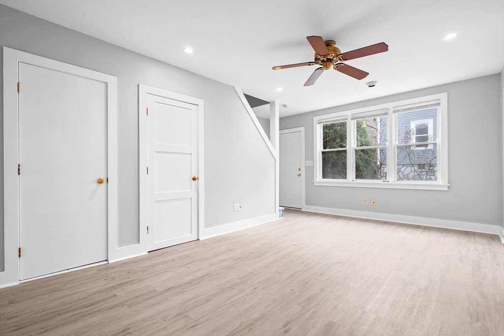 572 William Street Fall River, MA 02721 - Photo 5 of 31 a view of empty room with wooden floor and ceiling fan
