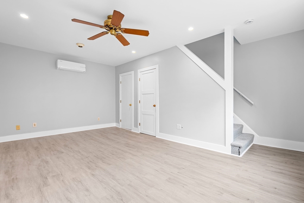 572 William Street Fall River, MA 02721 - Photo 6 of 31 wooden floor in an empty room with a window