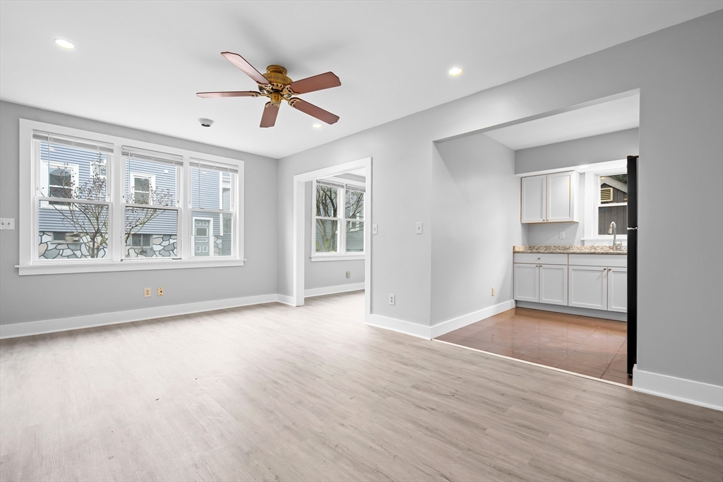 572 William Street Fall River, MA 02721 - Photo 7 of 31 a view of an empty room with window and wooden floor