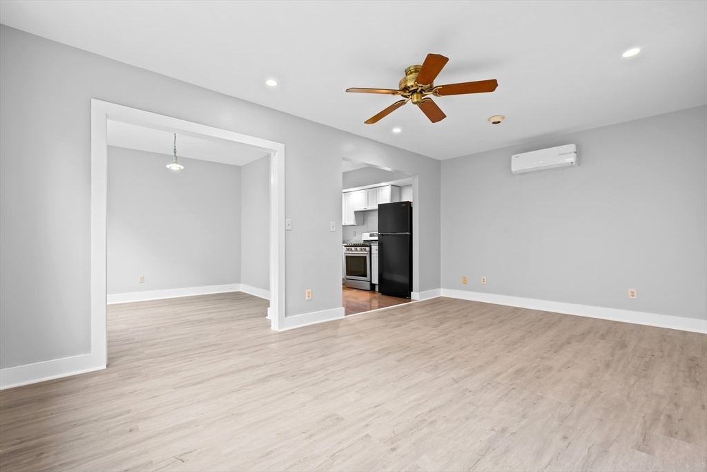 572 William Street Fall River, MA 02721 - Photo 8 of 31 a view of an empty room with window and wooden floor