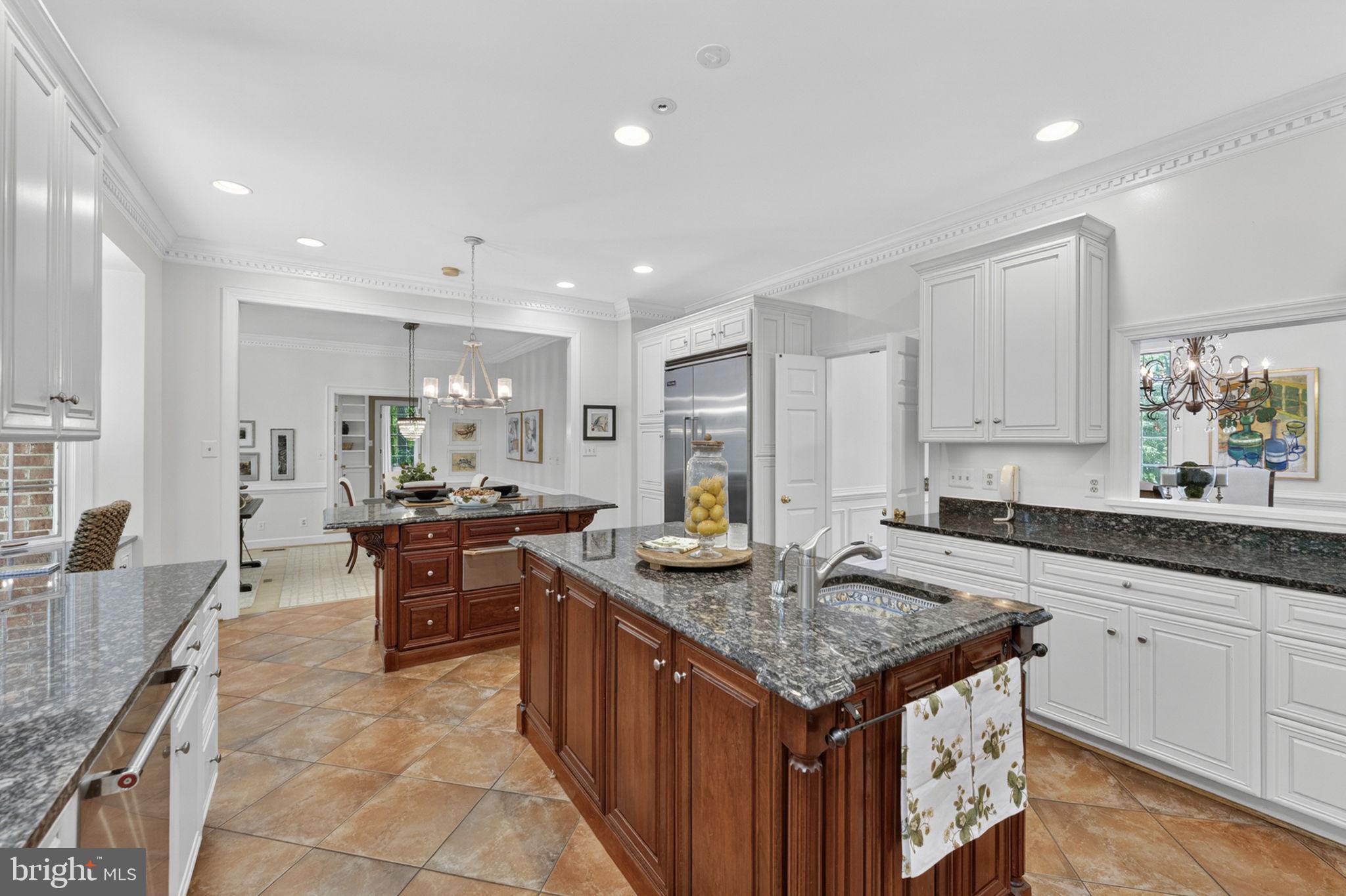 4531 Den Haag Road Warrenton, VA 20187 - Photo 31 of 103 a kitchen with granite countertop kitchen island stainless steel appliances a sink stove and cabinets
