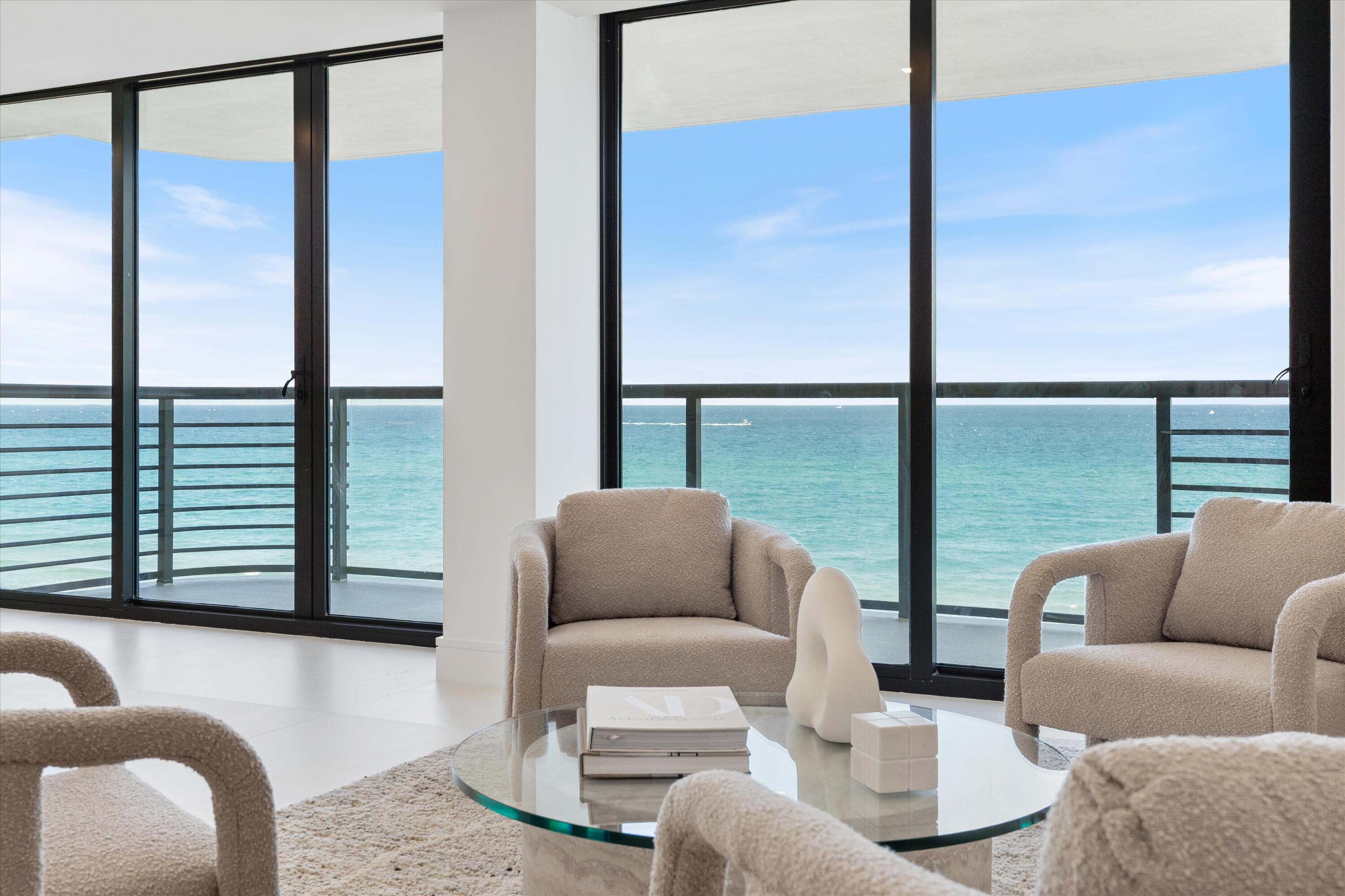 250 South Ocean Boulevard, Unit 3E & 3F Boca Raton, FL 33432 - Photo 12 of 46 a living room with furniture and a large window