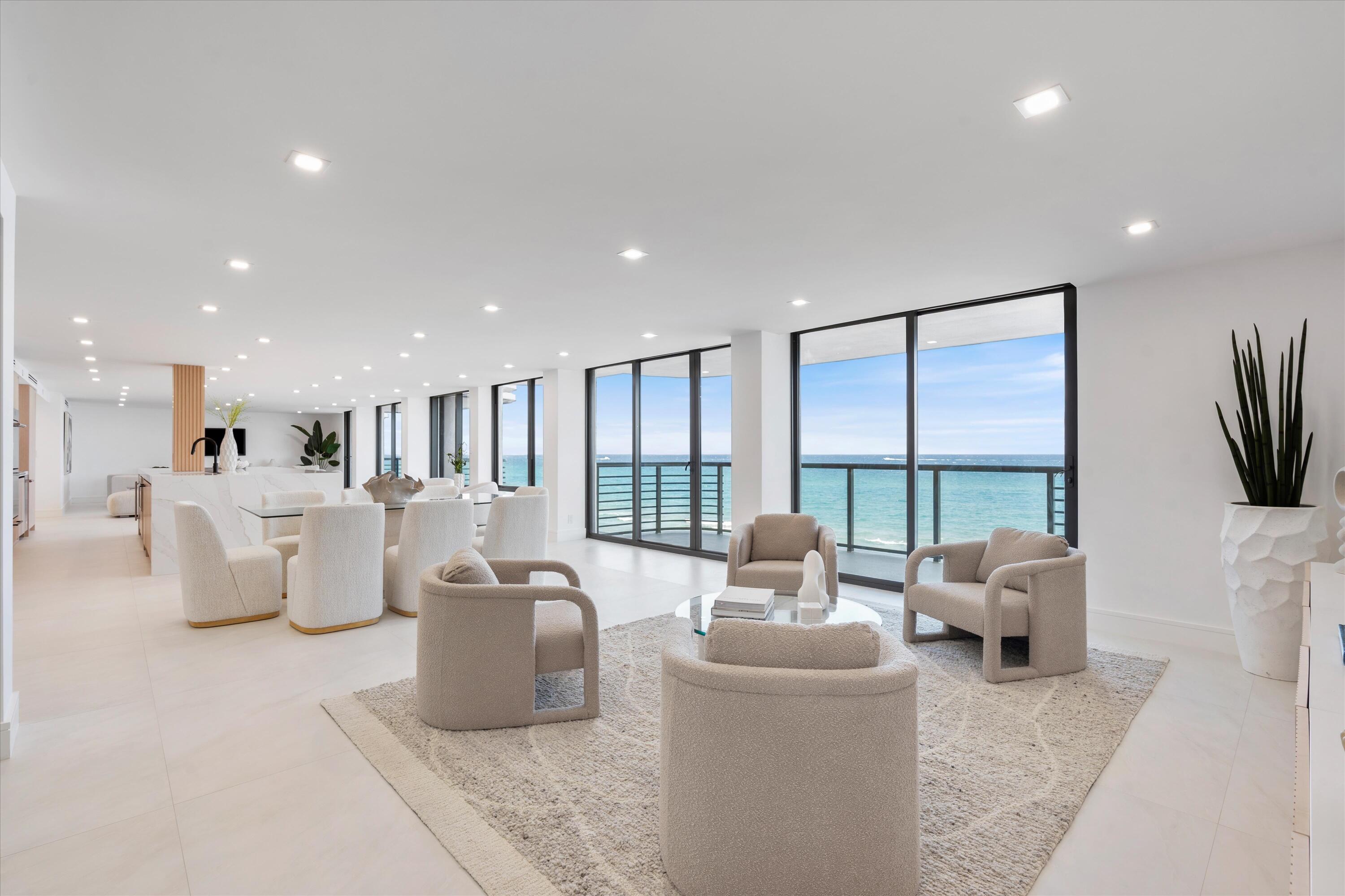 250 South Ocean Boulevard, Unit 3E & 3F Boca Raton, FL 33432 - Photo 13 of 46 a living room with furniture and a large window