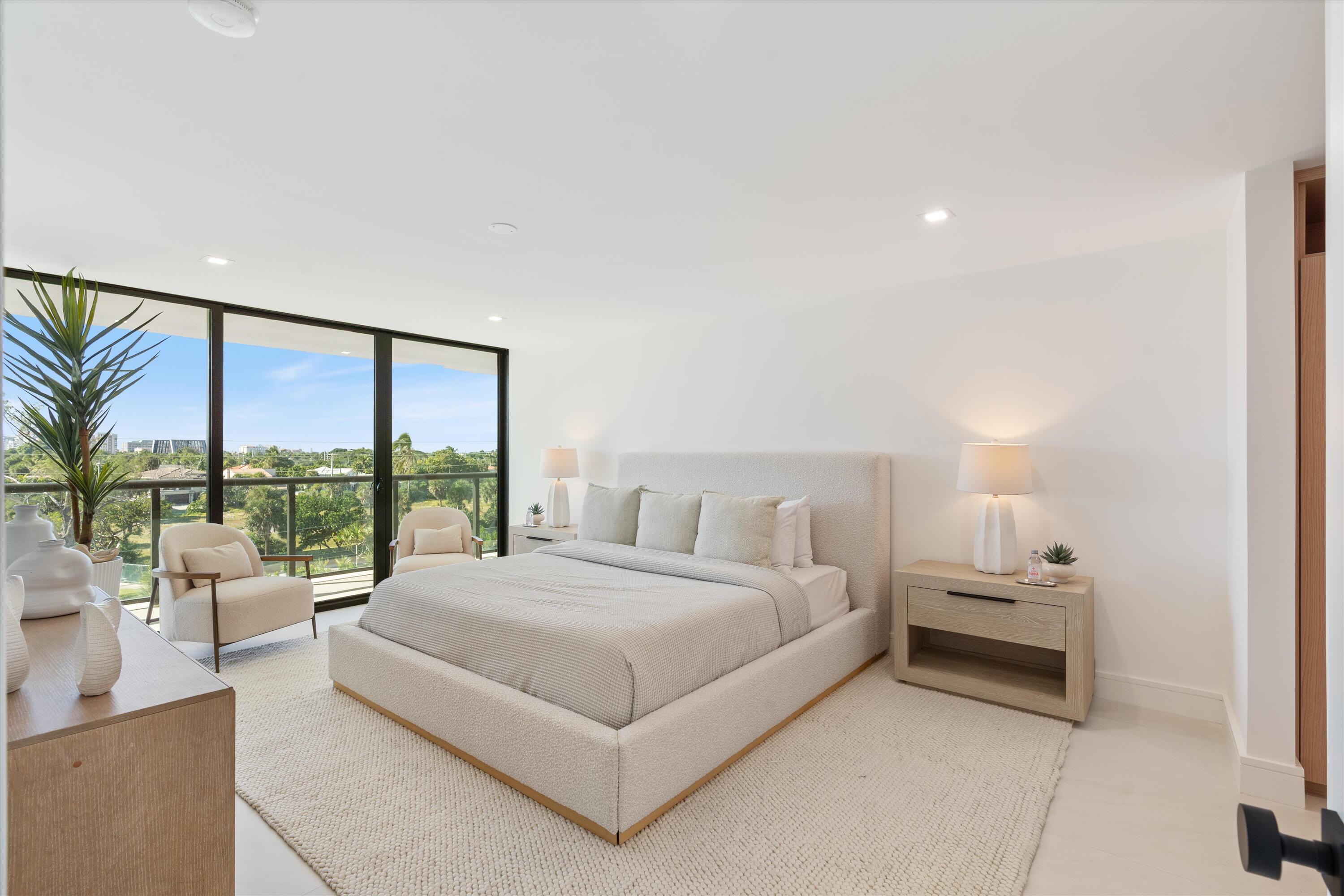 250 South Ocean Boulevard, Unit 3E & 3F Boca Raton, FL 33432 - Photo 21 of 46 a bedroom with a large bed and a large window