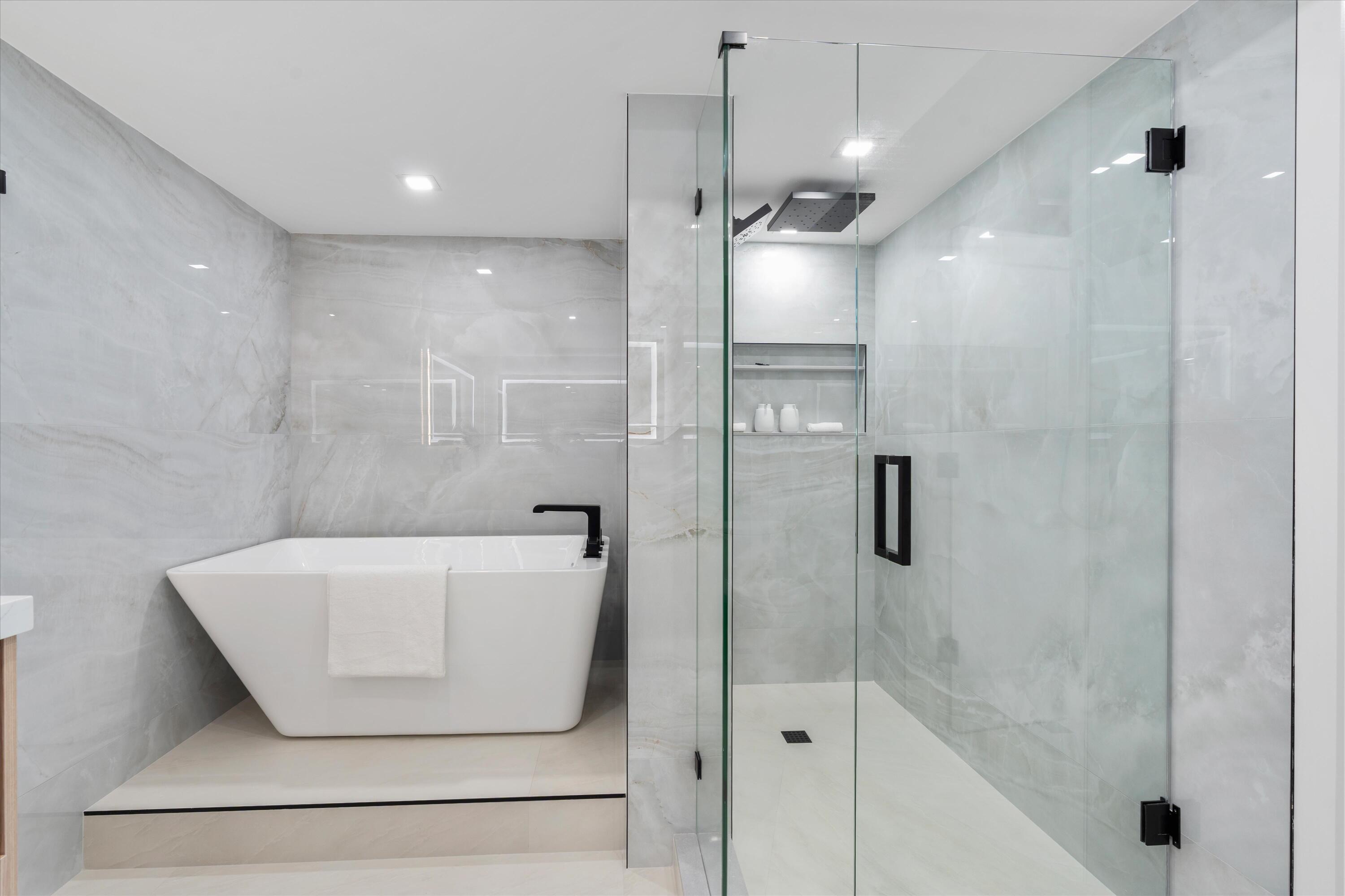 250 South Ocean Boulevard, Unit 3E & 3F Boca Raton, FL 33432 - Photo 24 of 46 a bathroom with a shower