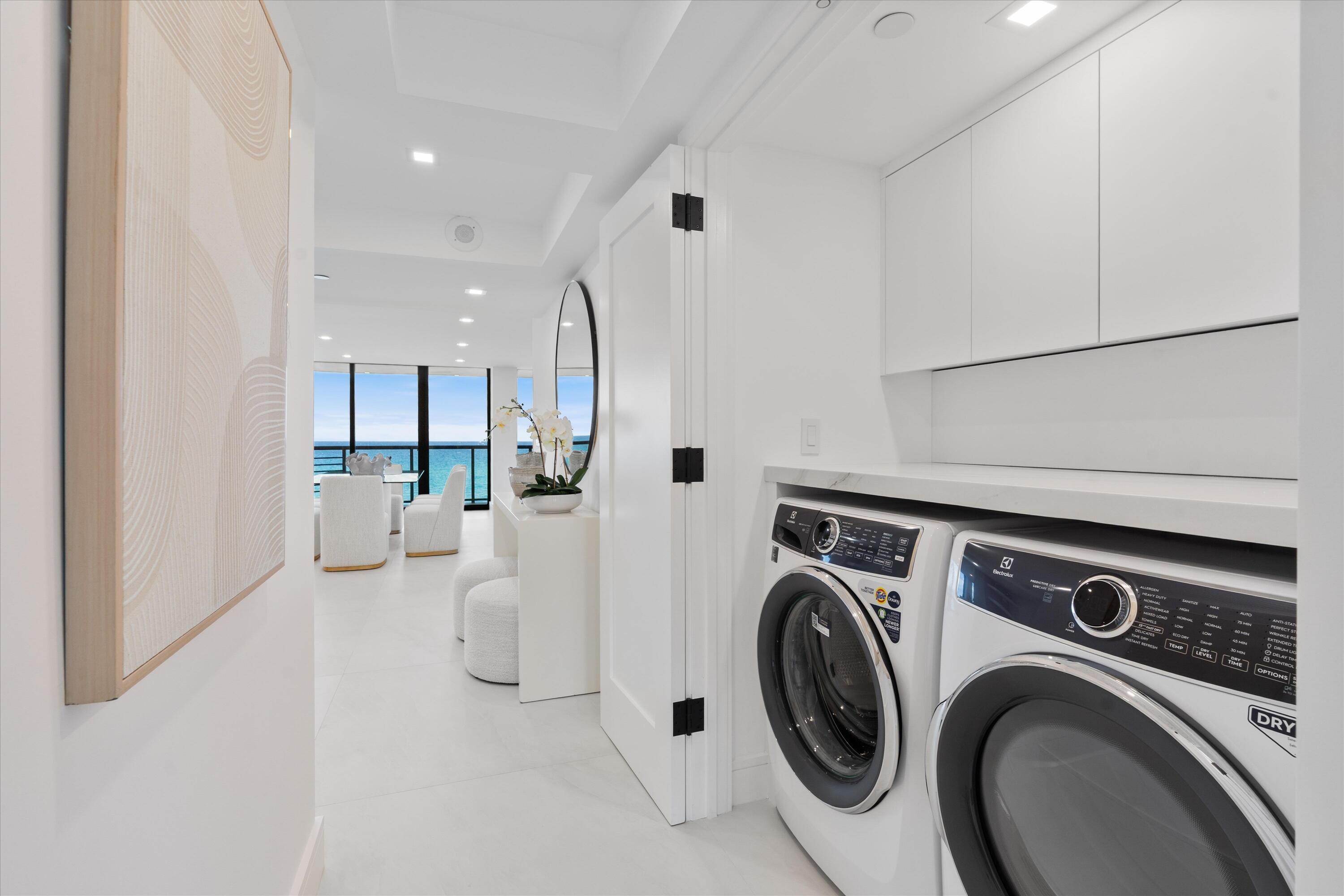 250 South Ocean Boulevard, Unit 3E & 3F Boca Raton, FL 33432 - Photo 32 of 46 a view of a kitchen with washer and dryer