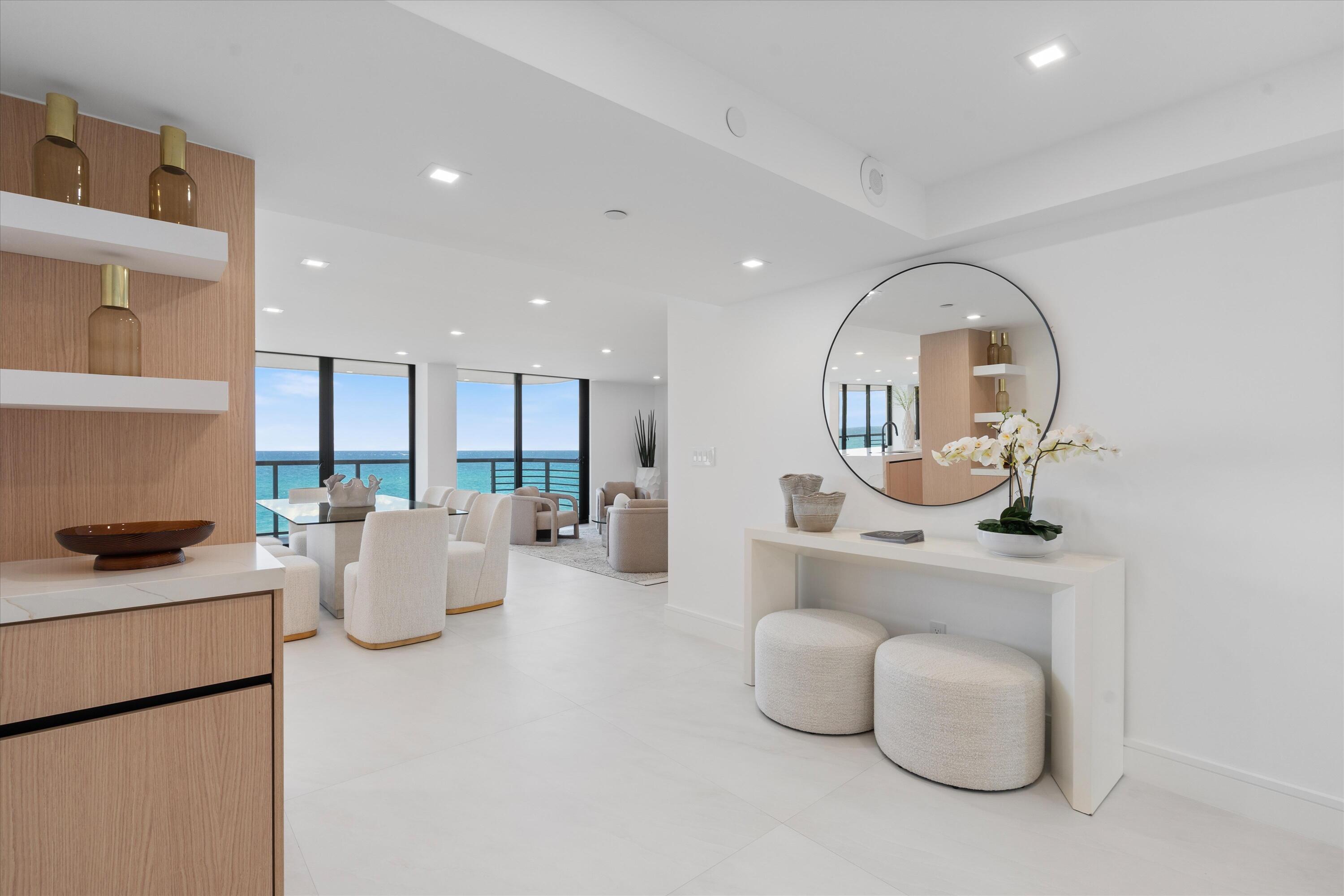 250 South Ocean Boulevard, Unit 3E & 3F Boca Raton, FL 33432 - Photo 4 of 46 a living room with furniture and a potted plant