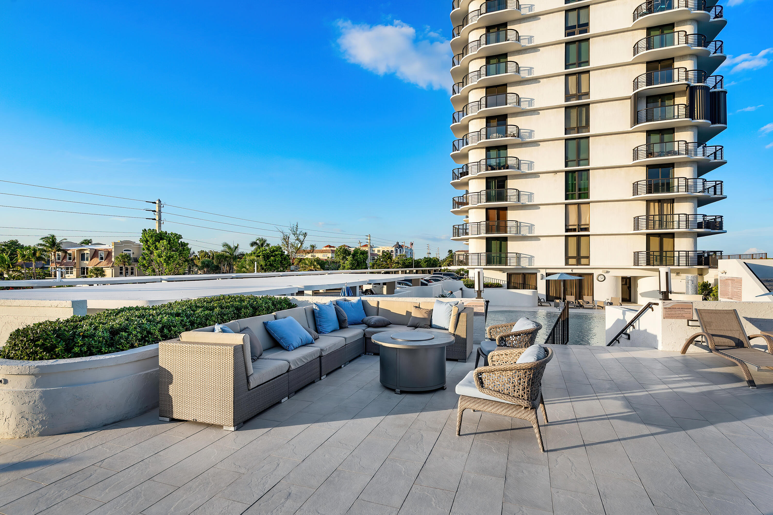250 South Ocean Boulevard, Unit 3E & 3F Boca Raton, FL 33432 - Photo 44 of 46 a view of roof deck with seating space and potted plants