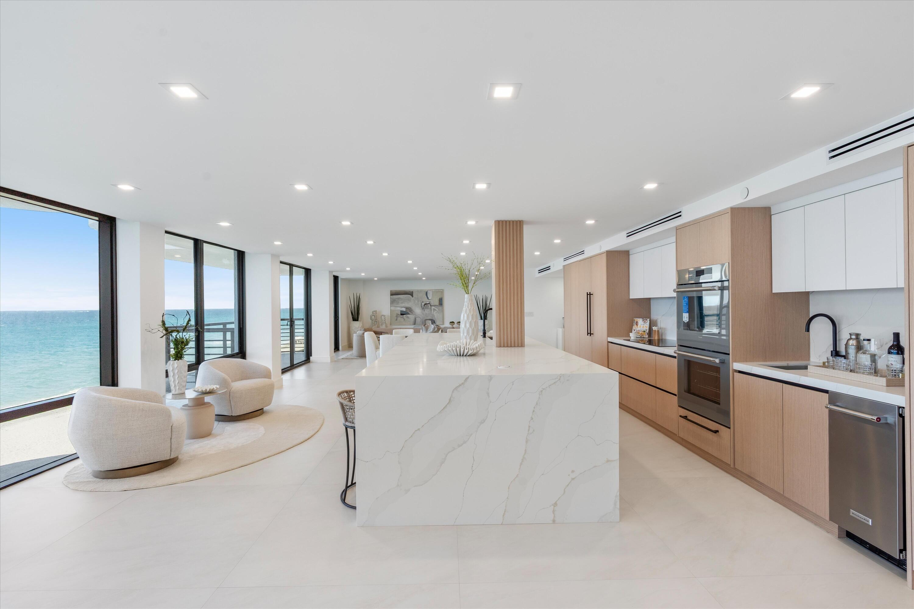 250 South Ocean Boulevard, Unit 3E & 3F Boca Raton, FL 33432 - Photo 8 of 46 a large white kitchen with a large window