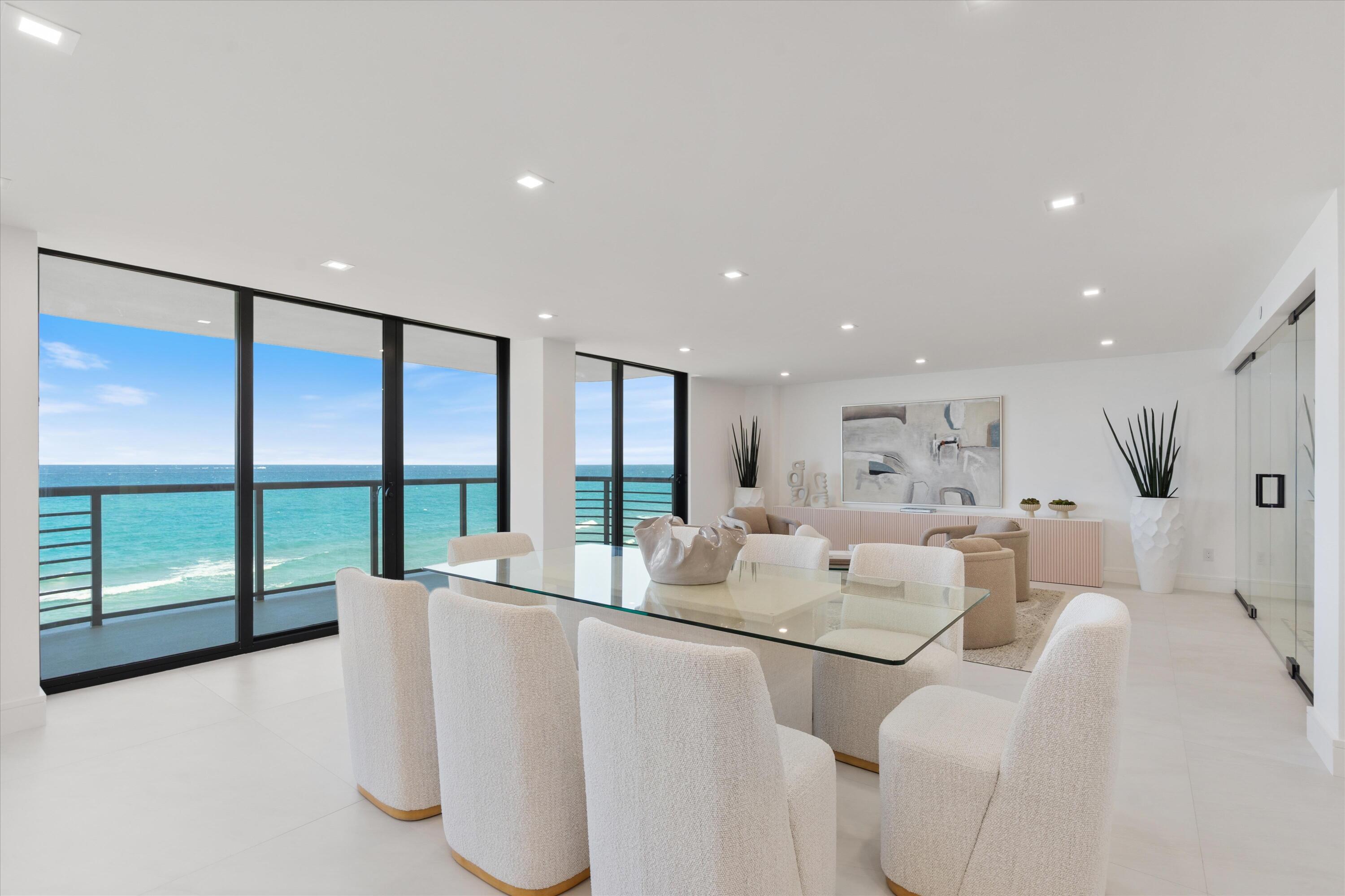 250 South Ocean Boulevard, Unit 3E & 3F Boca Raton, FL 33432 - Photo 9 of 46 a living room with furniture and large windows