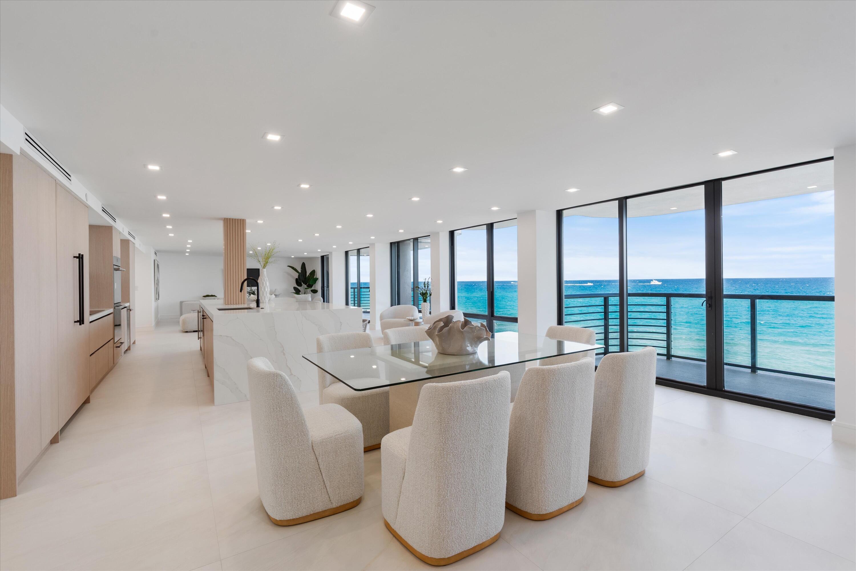 250 South Ocean Boulevard, Unit 3E & 3F Boca Raton, FL 33432 - Photo 10 of 46 a dining room with stainless steel appliances furniture and large windows
