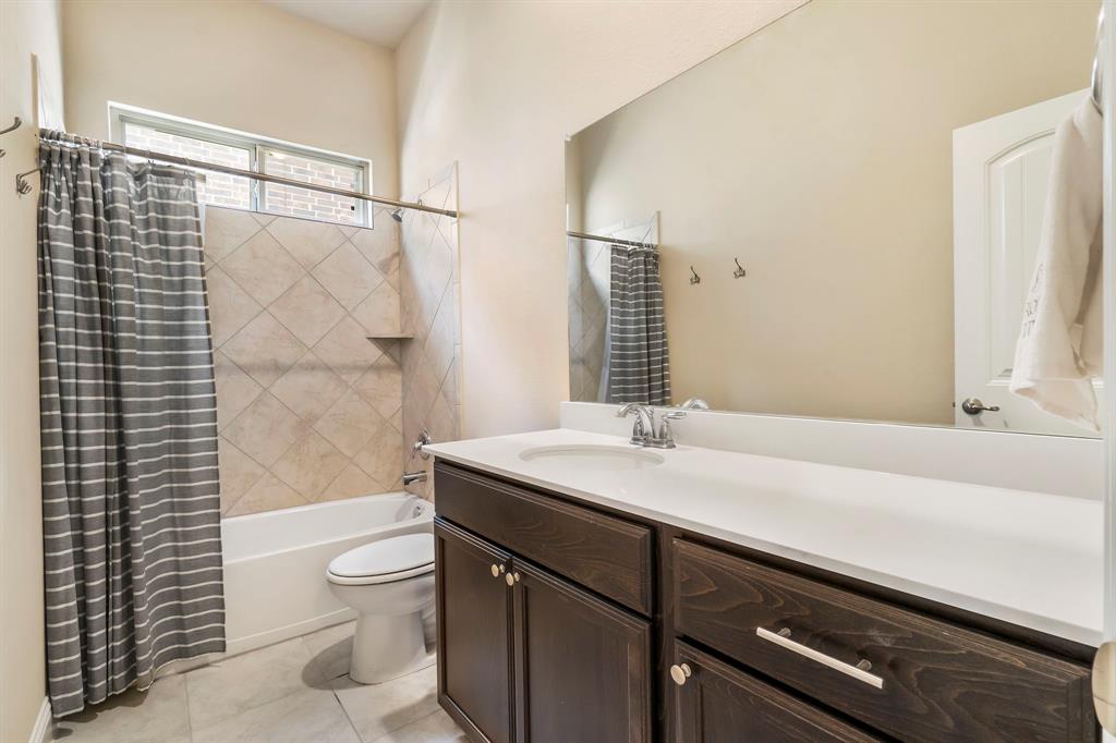 3610 Bastrop Street Melissa, TX 75454 - Photo 19 of 23 a bathroom with a sink a toilet and shower