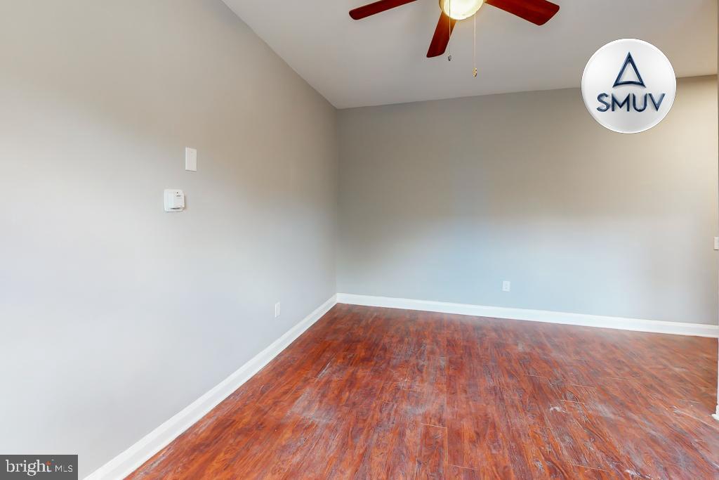 1605 Homestead Street, Unit 1 Baltimore, MD 21218 - Photo 17 of 18 a view of a room with wooden floor