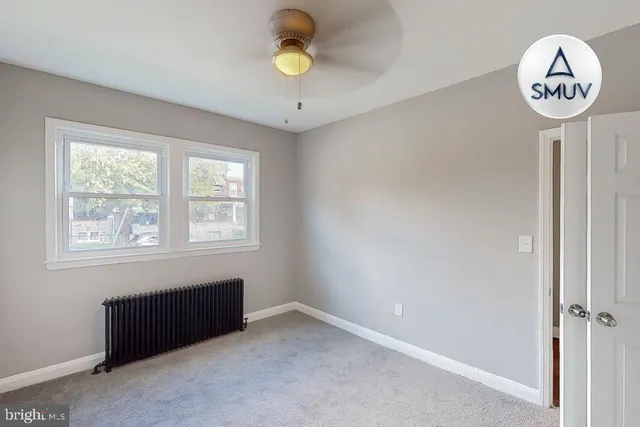 a view of a hallway with a window