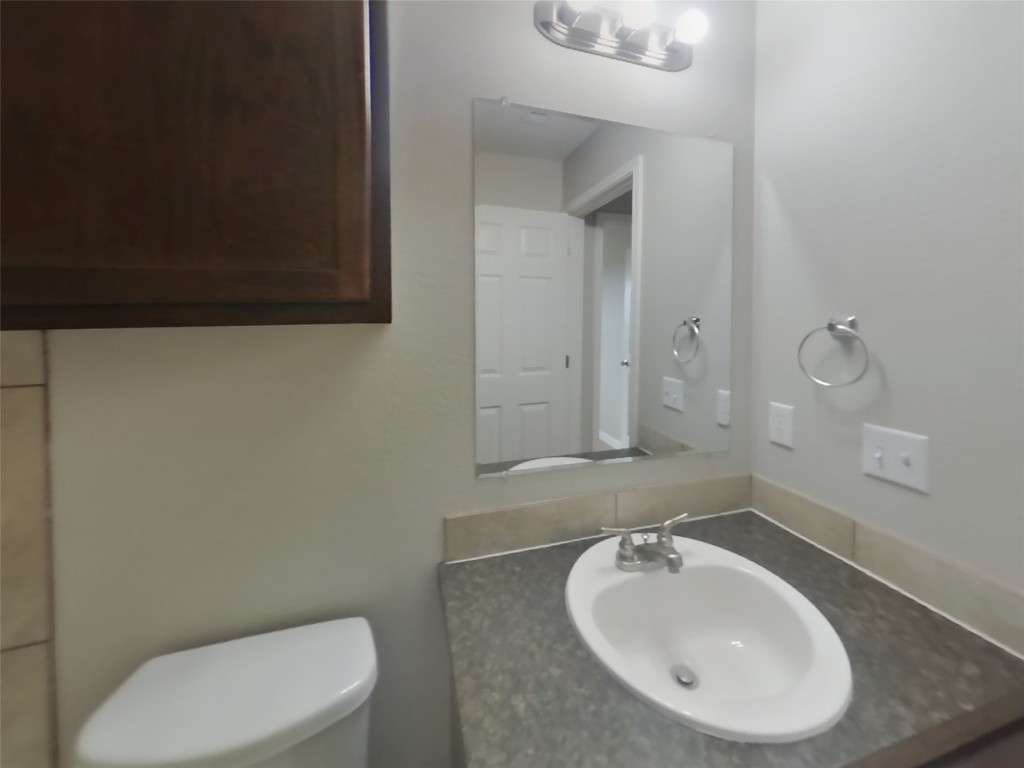 1027 Trail Driver Cove Georgetown, TX 78626 - Photo 12 of 17 Bathroom with vanity and toilet